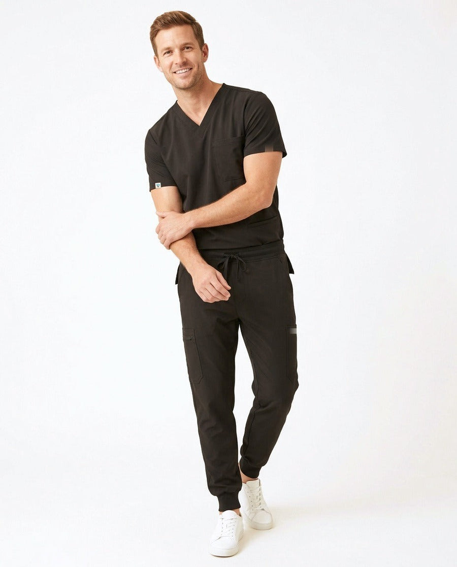 Men's Element V-neck top and Vector jogger pants scrub set in Black – front view | Threadicine