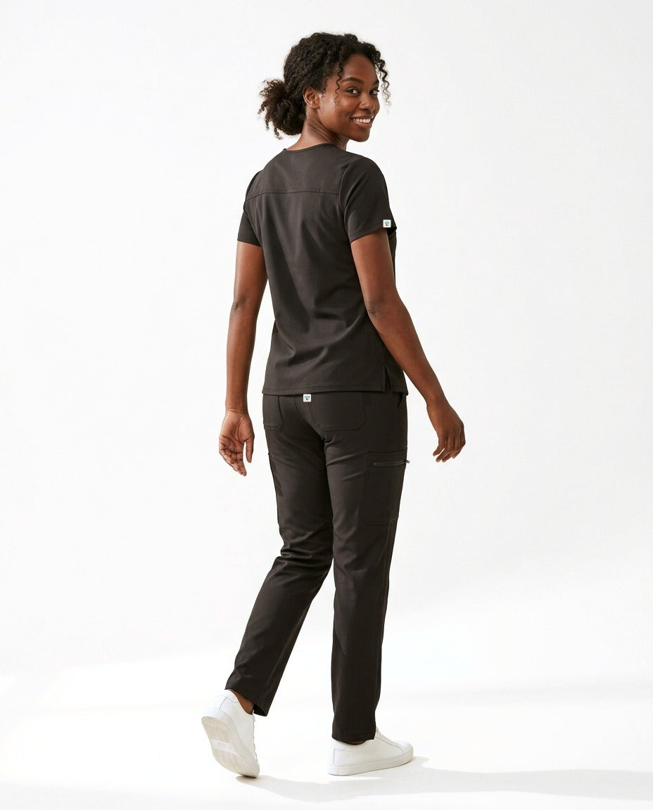 Women's Atelier V-neck top and Linea straight-leg pants scrub set in Black – back view | Threadicine