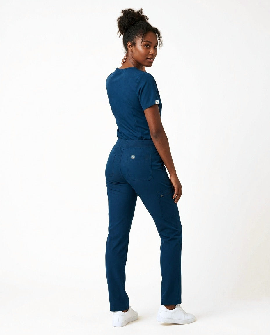 Women's Atelier V-neck top and Linea straight-leg pants scrub set in Blue – back view | Threadicine