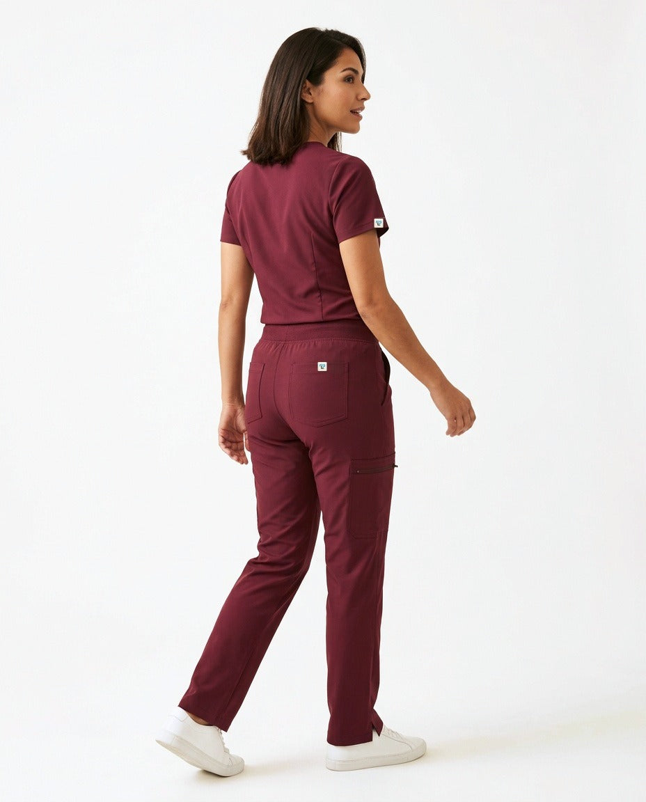 Women's Atelier V-neck top and Linea straight-leg pants scrub set in Burgundy – back view | Threadicine