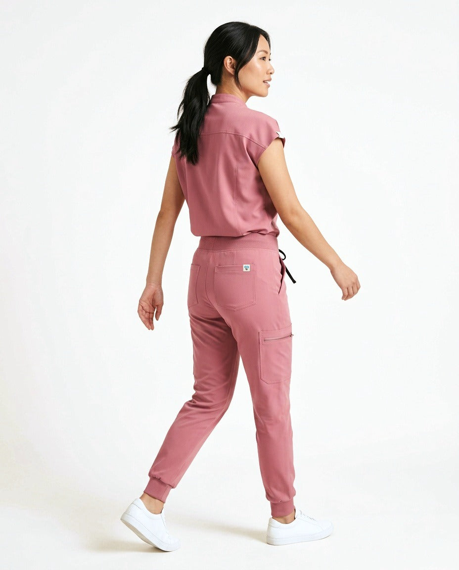 Women's Contour mandarin-collar top and Motive jogger pants scrub set in Pink – back view | Threadicine