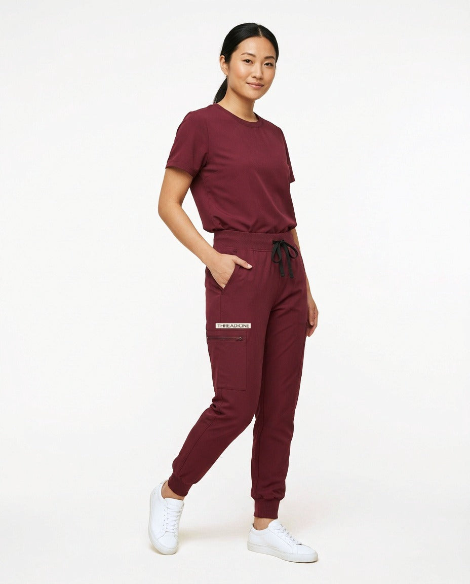 Women's Motive jogger pants scrubs in Burgundy – front view | Threadicine